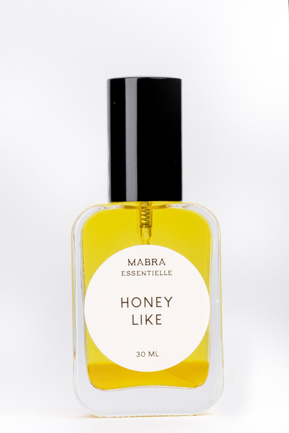 Bottle of Mabra Essentielle Honey Like perfume on a white background