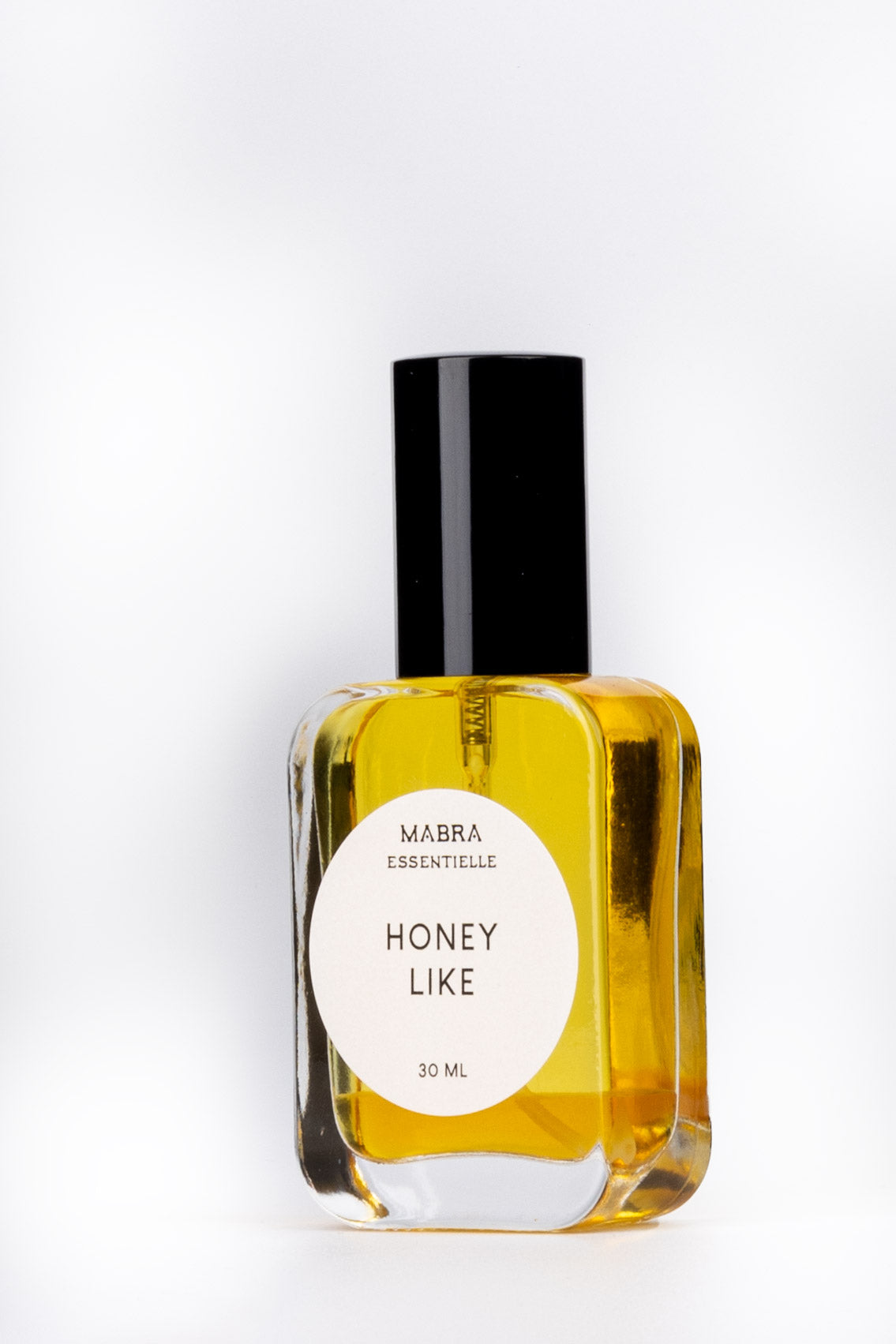 Bottle of Mabra Essentielle Honey Like perfume on a white background